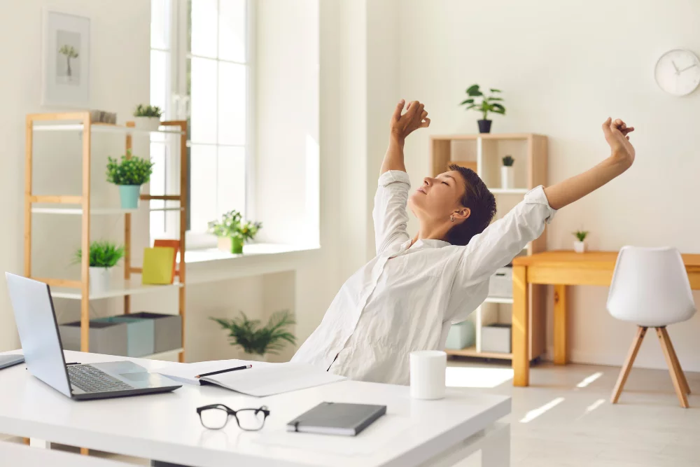 Remote employee taking a structured active break at a home workstation